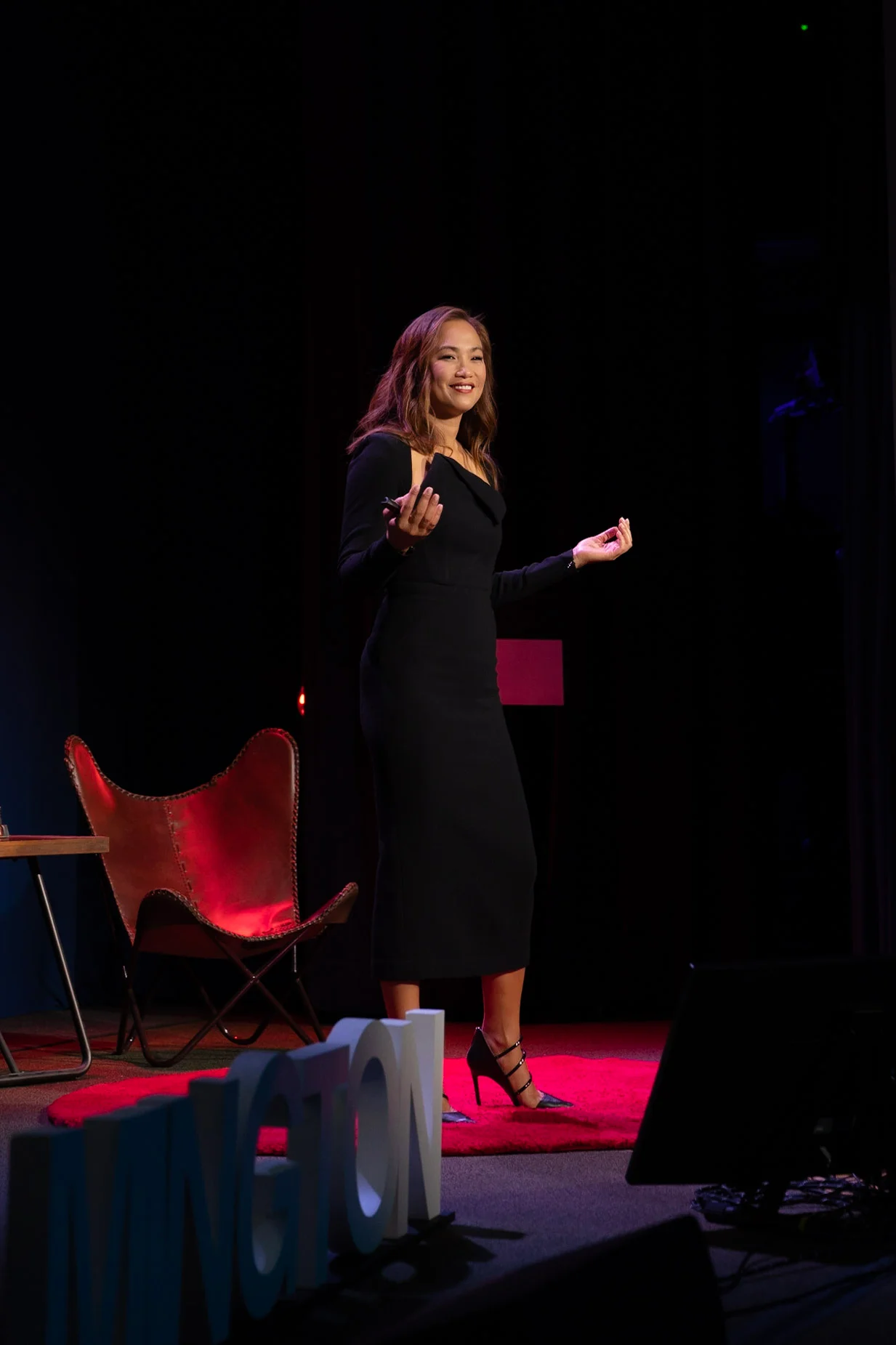 Joy Vanichkul speaking on stage